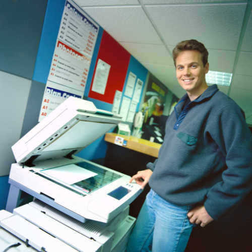 Man Operating Photocopier